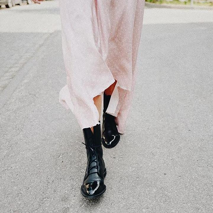 Black lace-up ankle boots with glossy toe cap and thick sole