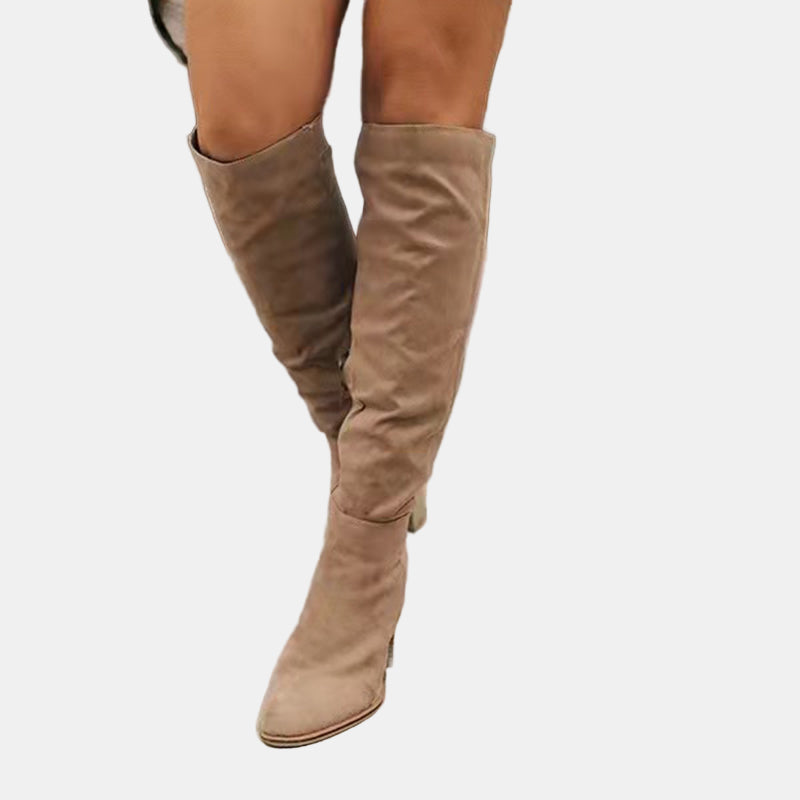 Beige slouchy heeled knee-high boots with stacked block heel and pointed toe