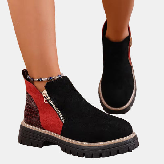 Orthopedic boots in black with red side panel and side zipper, chunky tread sole