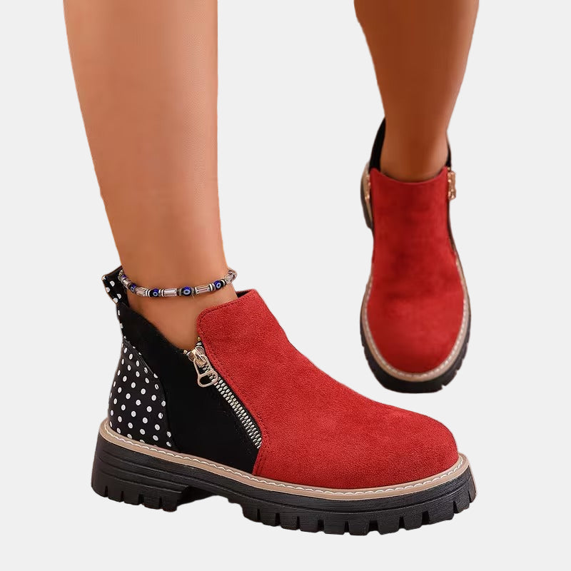 Red and black orthopedic ankle boots with side zipper and chunky tread sole