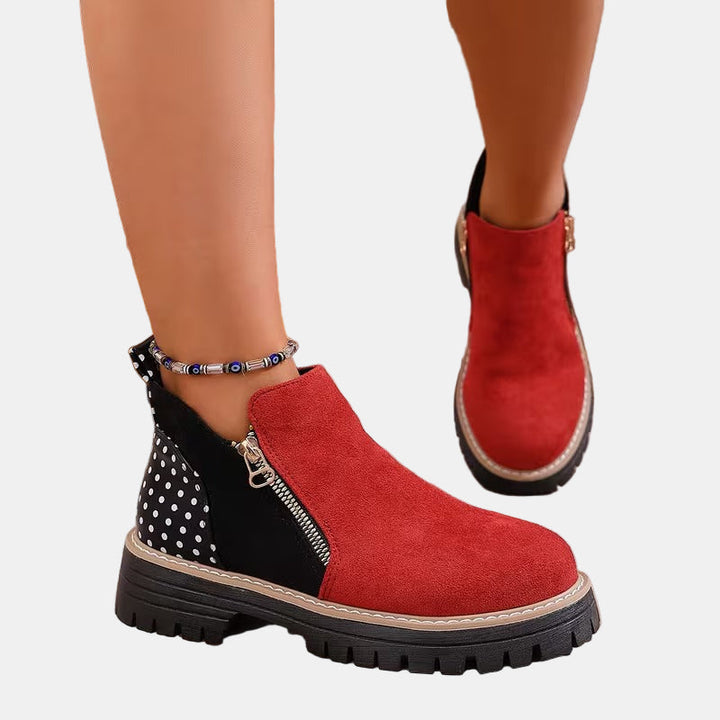 Red and black orthopedic ankle boots with side zipper and chunky tread sole