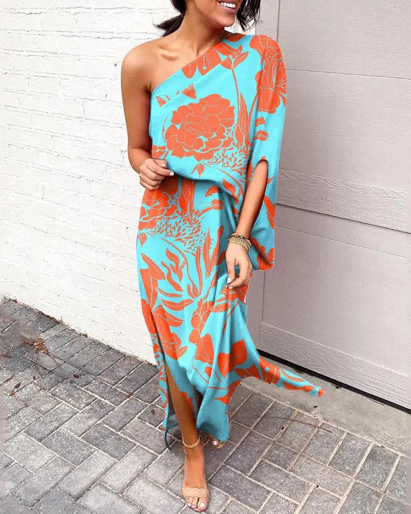 One-shoulder floral maxi dress in light blue with orange and teal botanical print