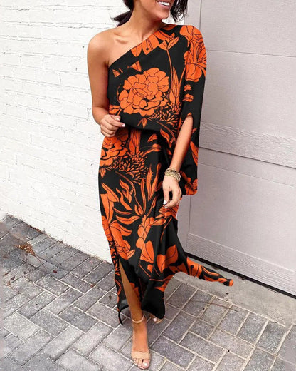 One-shoulder floral maxi dress in black with orange and red botanical print