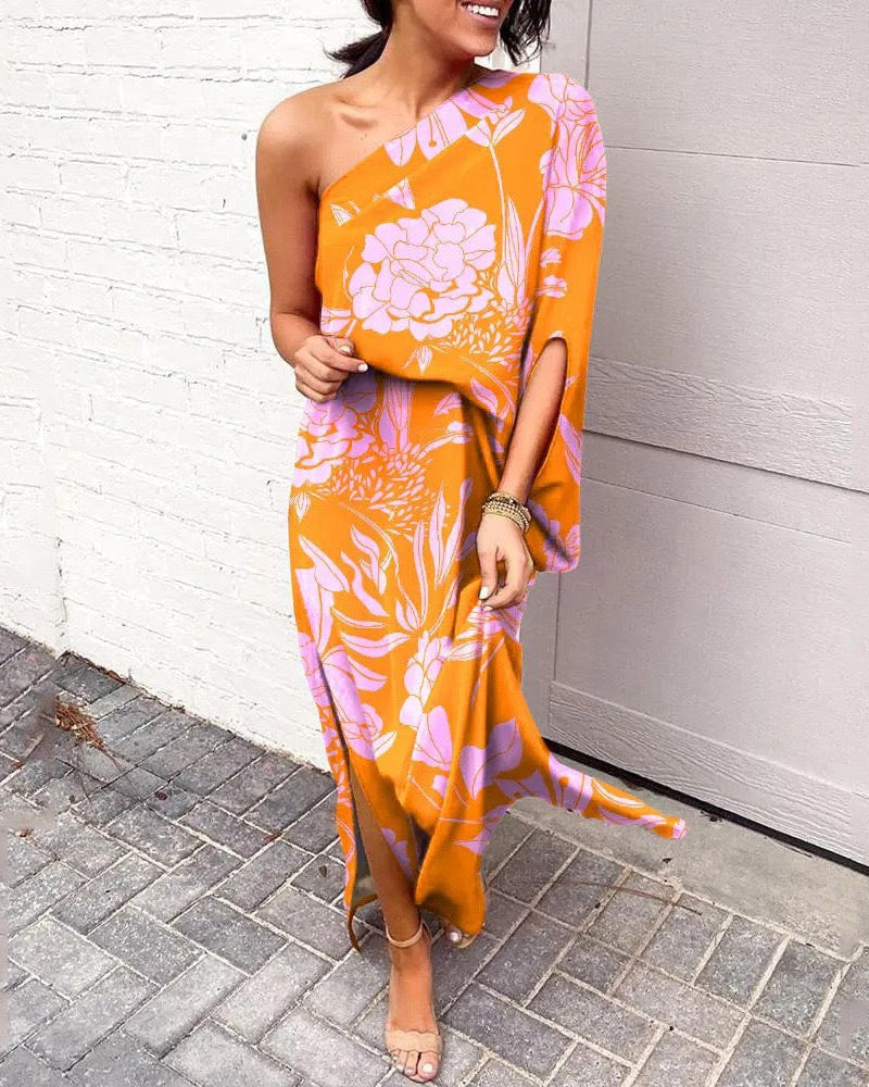 One-shoulder floral maxi dress in orange with pink and purple botanical print