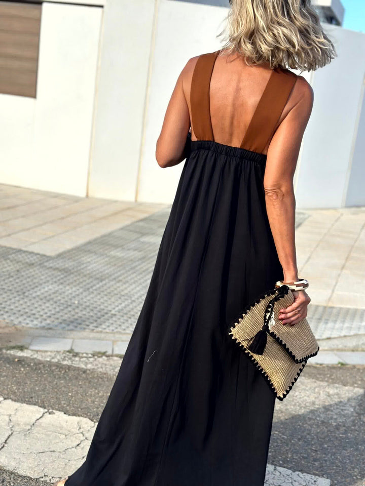 Back view: dark crossed halter maxi dress with open back and crisscross straps