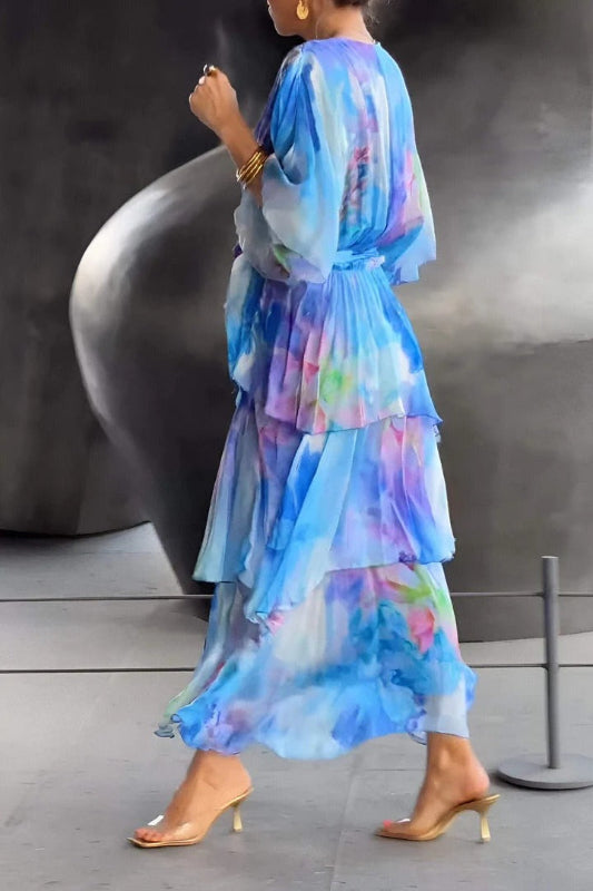 Blue printed tiered dress with V-neck and flutter sleeves; back view