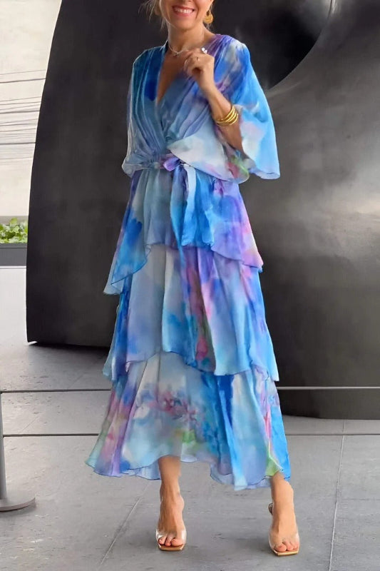 Blue printed V-neck maxi dress with flutter sleeves and tiered ruffles, front view
