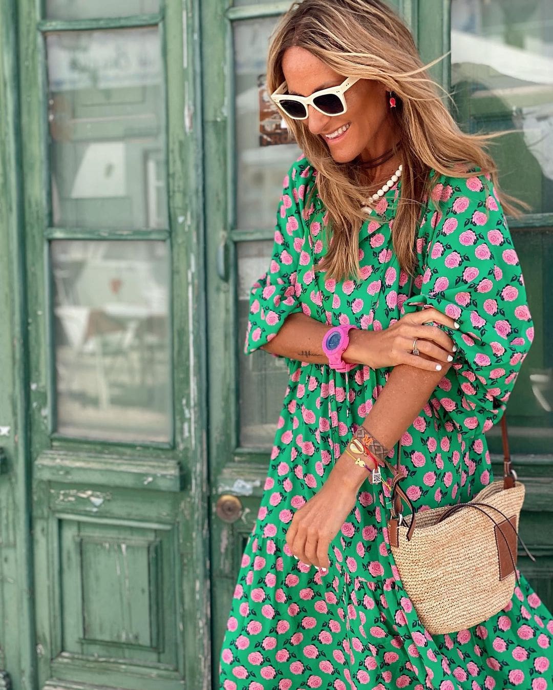 Green spring dress with pink rose print, flowing tiers and V-neckline