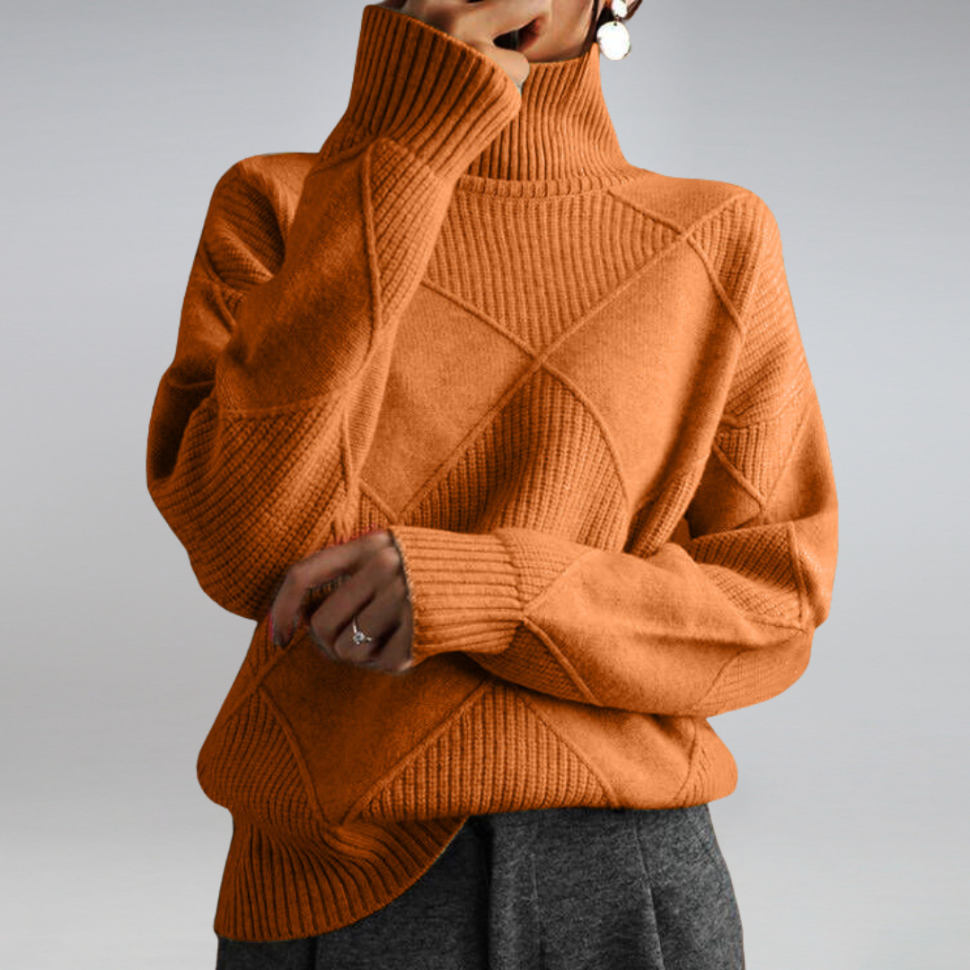 Orange ribbed turtleneck pullover with crisscross cable pattern, long sleeves