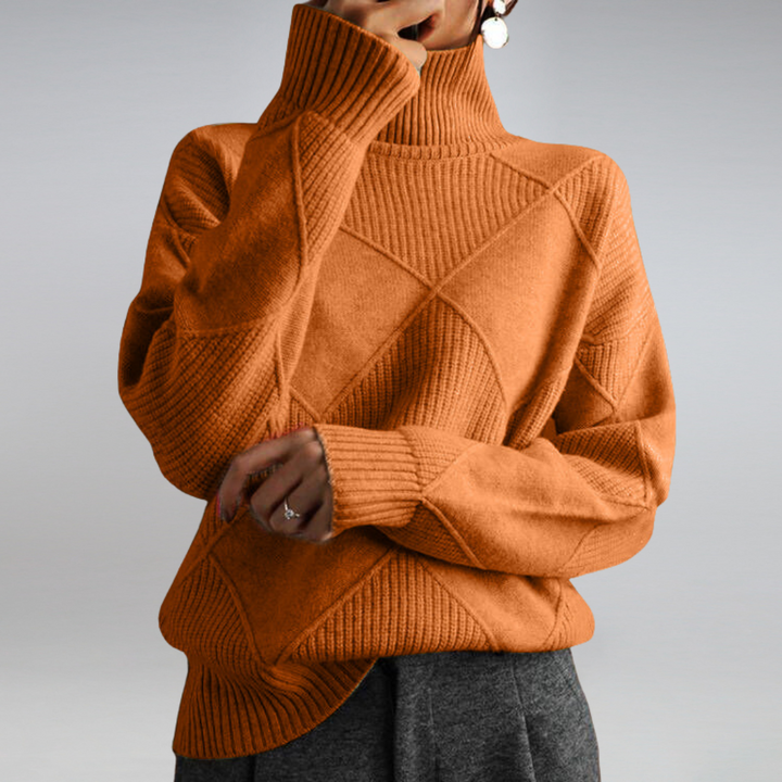 Orange ribbed turtleneck pullover with crisscross cable pattern, long sleeves