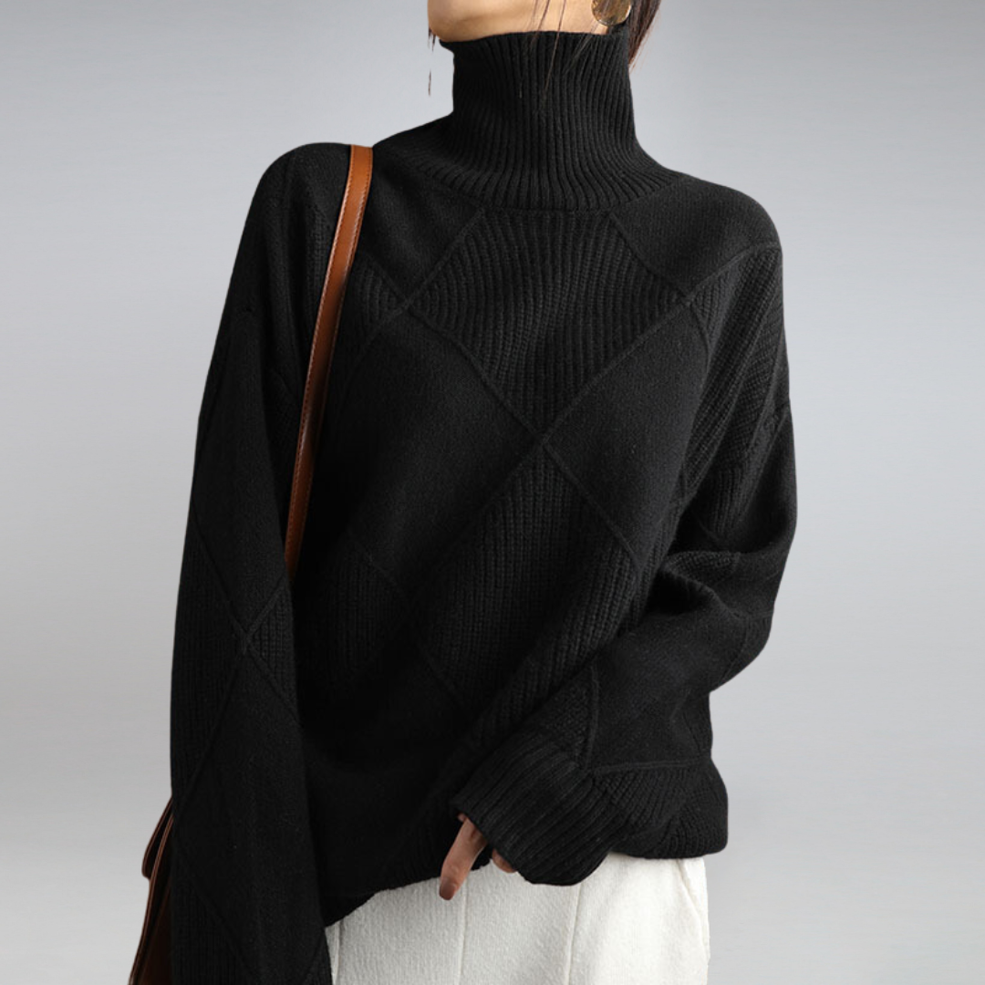 Black ribbed turtleneck pullover with crisscross cable pattern and ribbed cuffs
