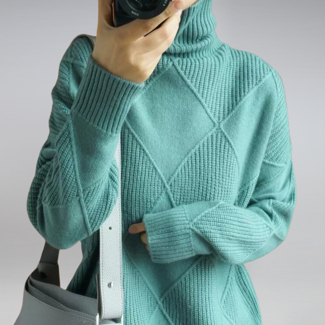 Teal ribbed turtleneck pullover with crisscross cable pattern and long sleeves