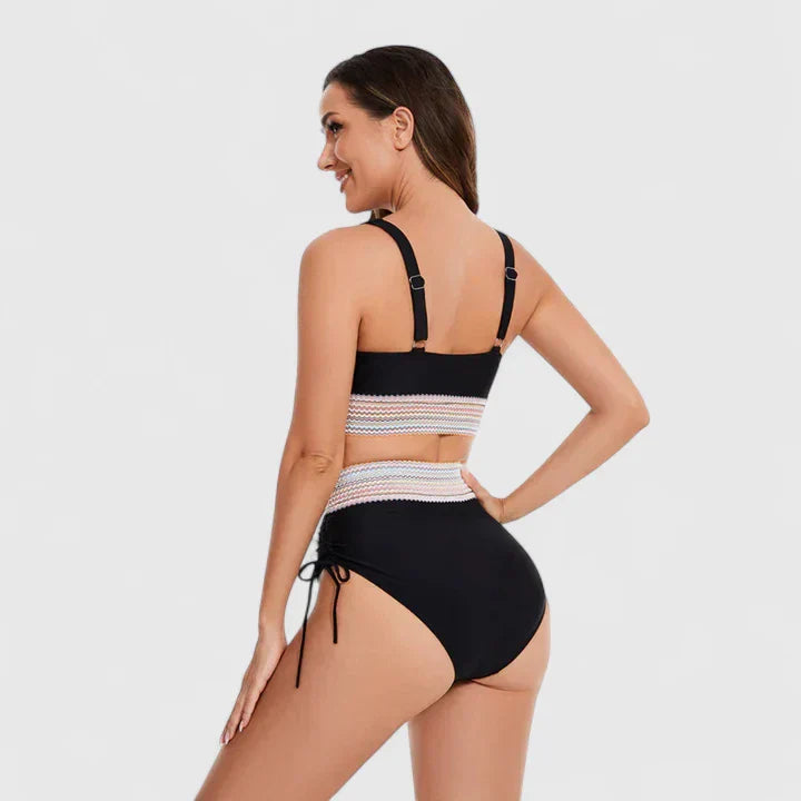Women’s black bikini set back view with striped waist band and tie-side bottoms