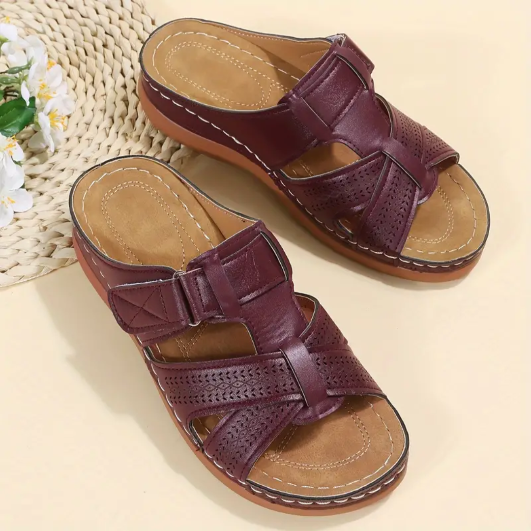 Burgundy ergonomic sandals with two straps, perforated sections, and tan footbed