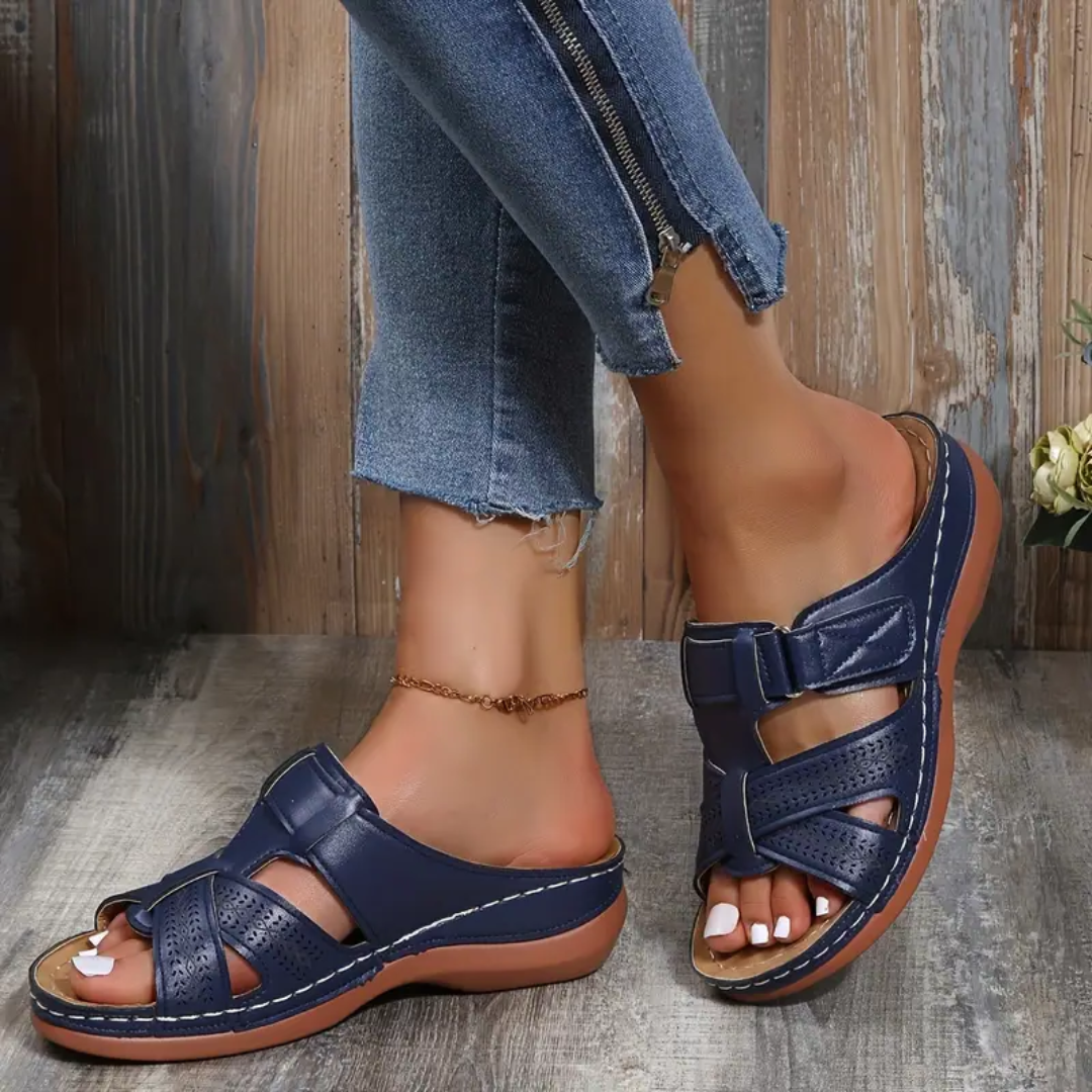 Navy ergonomic sandals with two wide hook-and-loop straps and perforated toe detail