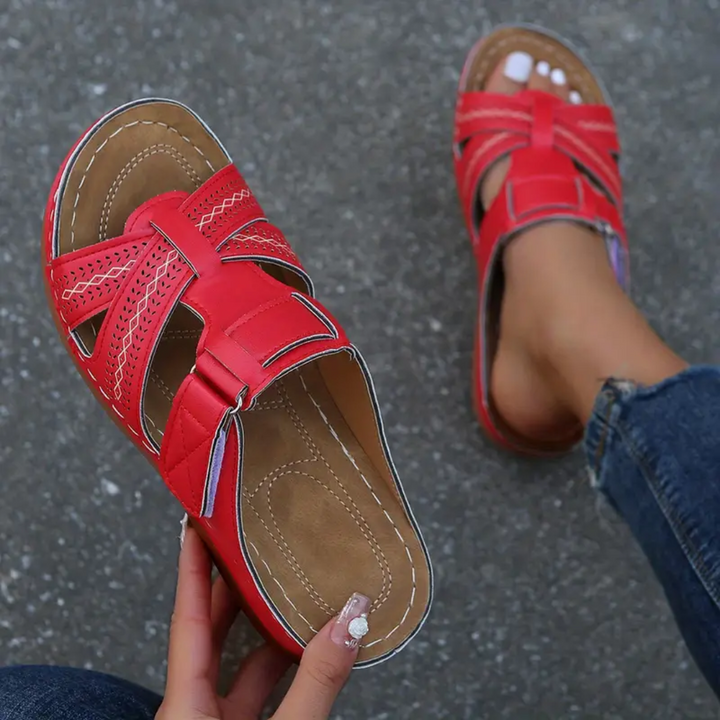 Vivian red ergonomic sandals close-up with perforated straps and buckle overfoot
