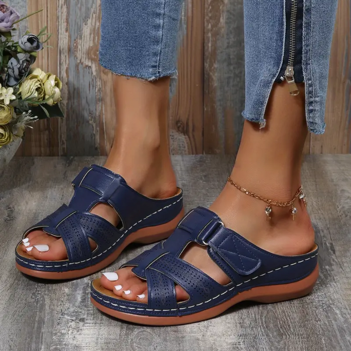 Navy ergonomic sandals with double straps and perforated leather-look panels on the toe