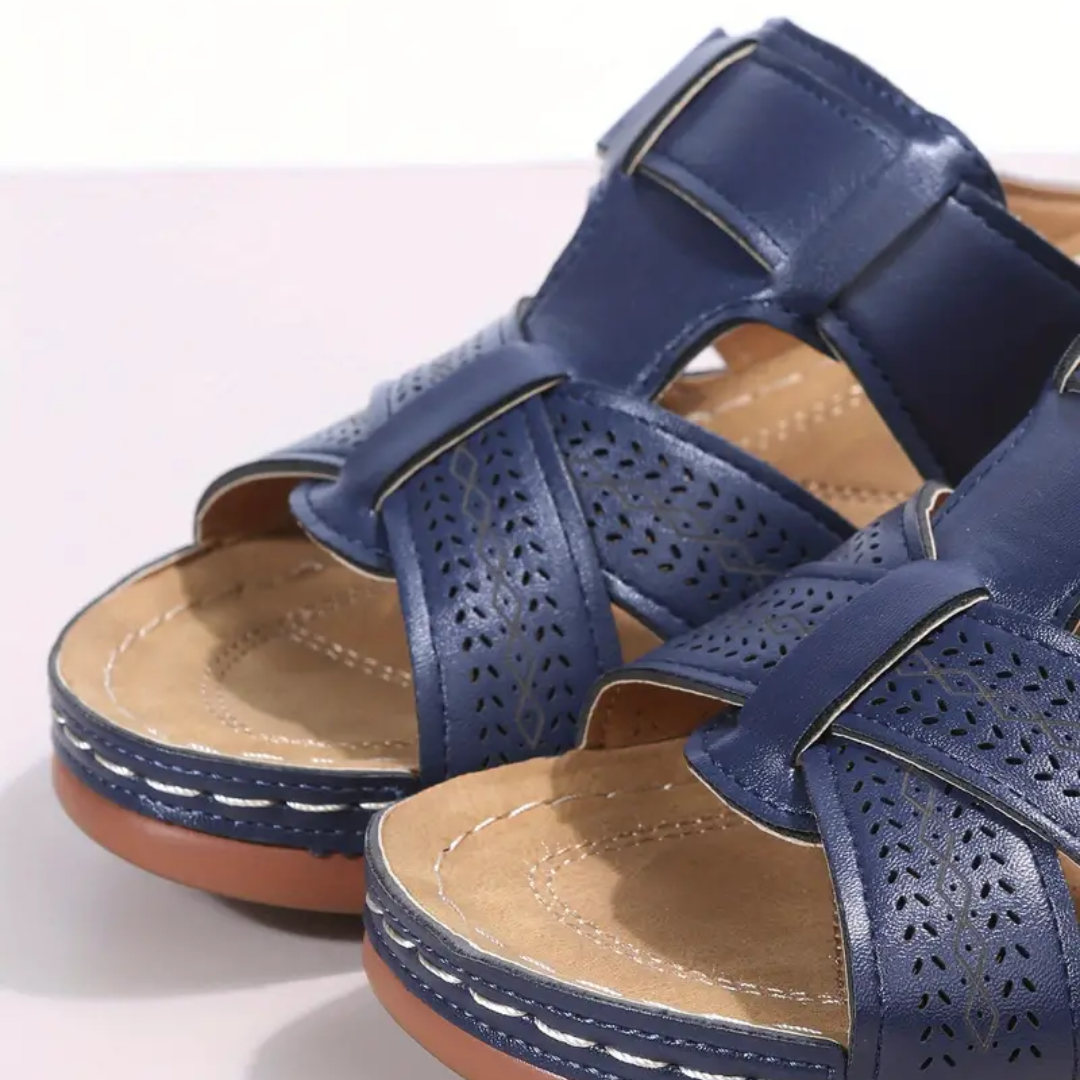 Navy ergonomic sandals with perforated straps and adjustable buckle