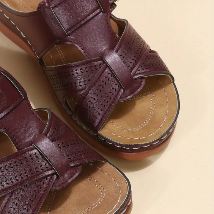Burgundy ergonomic sandals with perforated panels and two adjustable strap closures