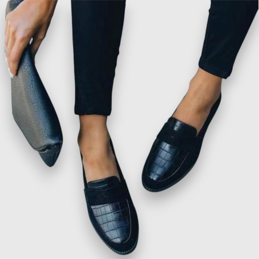 Dark moccasin shoe with croc-embossed vamp and side strap detail