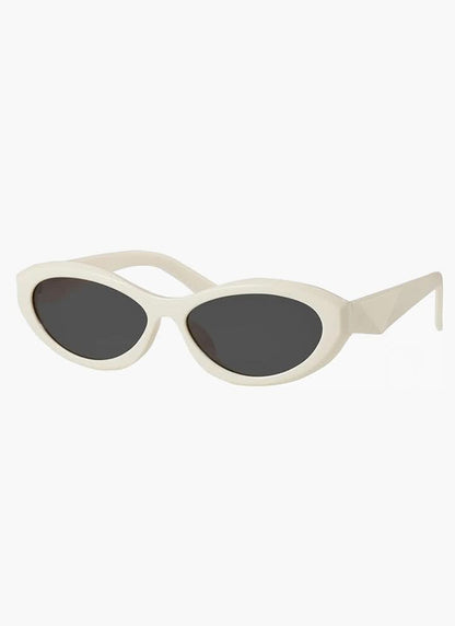 Cream cat-eye minimalist sunglasses with dark lenses and slim arms