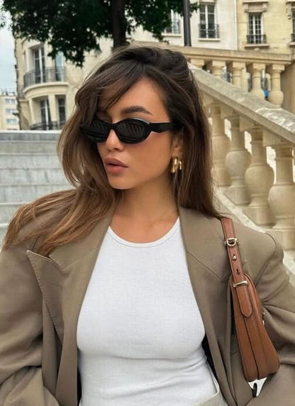 Black cat-eye sunglasses 3/4 view with dark lenses on face
