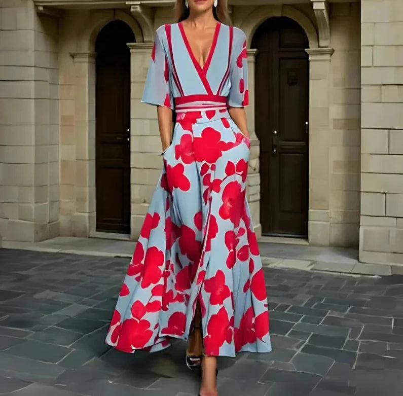 Floral maxi dress in light blue with bold red blossoms, V-neck, short sleeves, belted waist