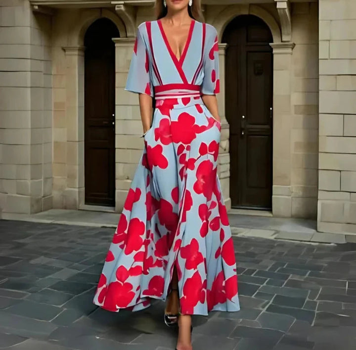 Floral maxi dress in light blue with bold red blossoms, V-neck, short sleeves, belted waist