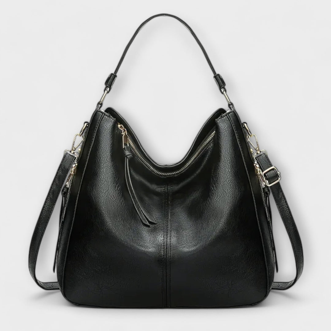 Large hobo handbag in black leather-look with front zip pocket and tassel pull tabs