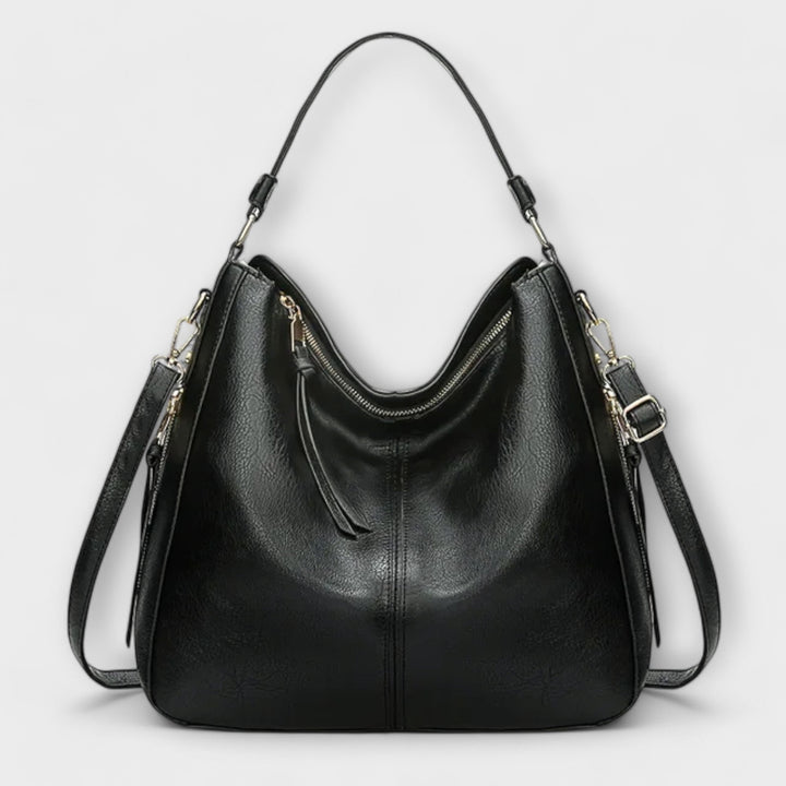 Large hobo handbag in black leather-look with front zip pocket and tassel pull tabs