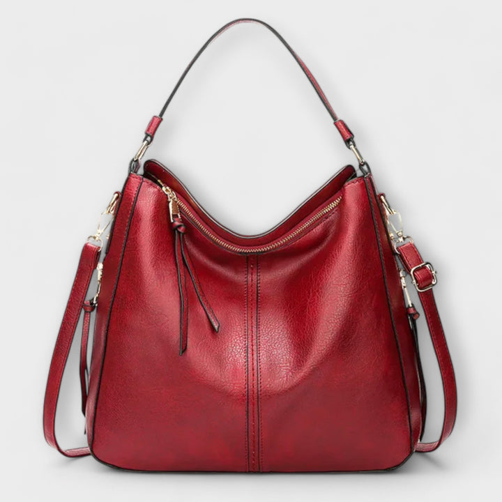 Large hobo handbag in red leather-look with zip pocket and tassel pull tabs