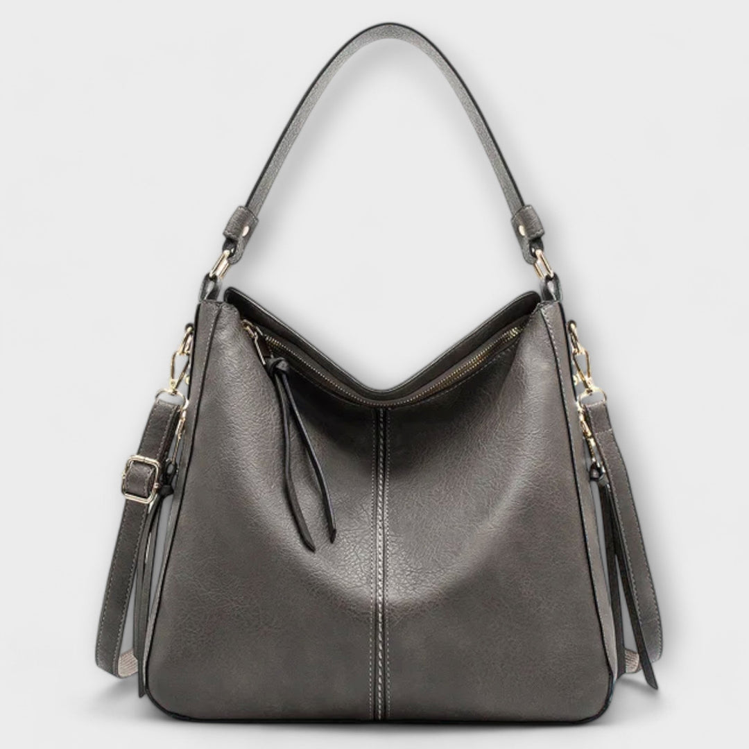Large hobo handbag in dark gray leather-look with front zipper and tassel pulls