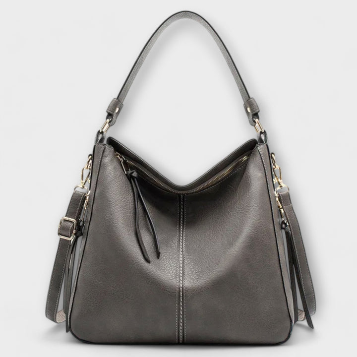 Large hobo handbag in dark gray leather-look with front zipper and tassel pulls