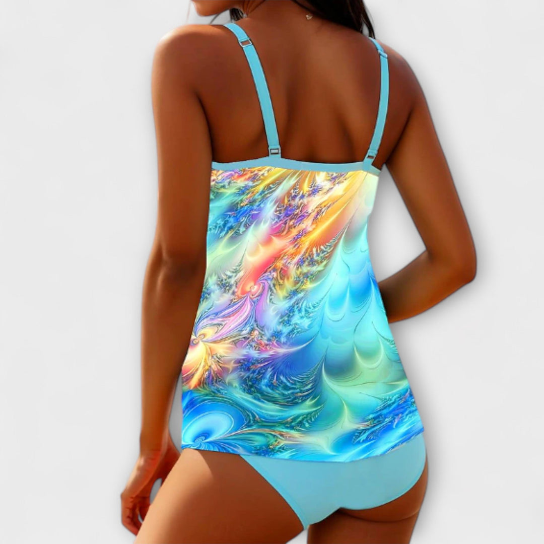 Tankini set back view with blue multicolor print tankini top and light blue briefs