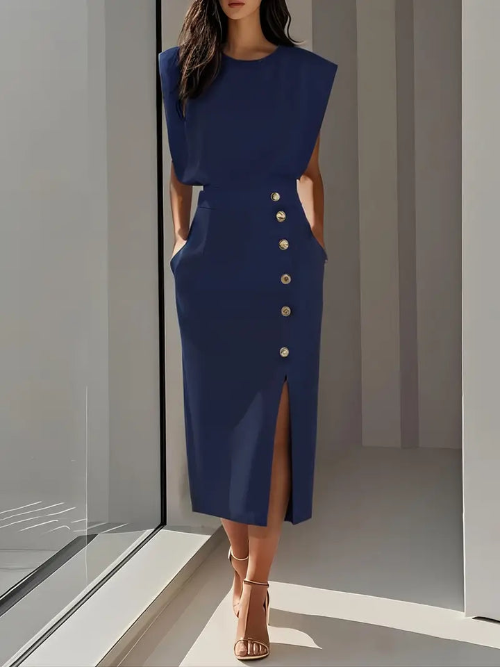 Navy midi dress, sleeveless, with gold button front and side slit.