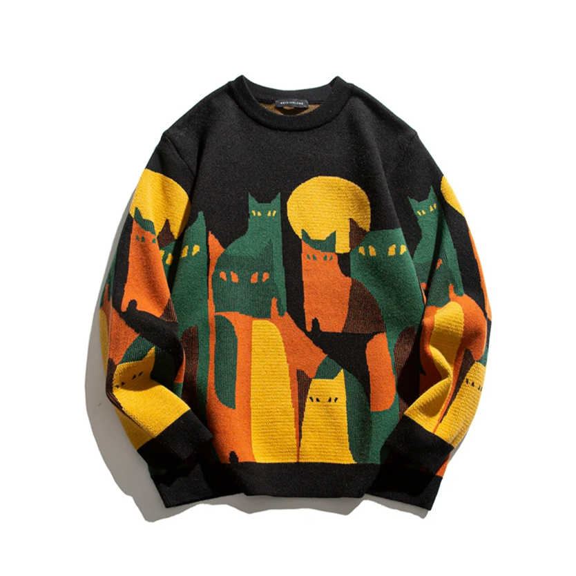 Black unisex cat sweater with orange green yellow knit graphic of houses and cats, crew neck