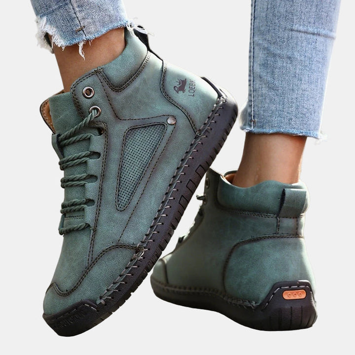 Green lace-up lightweight comfort sneakers with cushioned heel and rubber tread sole
