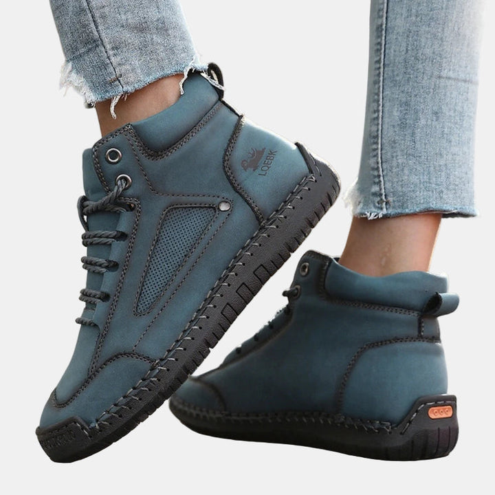 Teal lace-up lightweight comfort sneakers with perforated panel and rubber tread sole