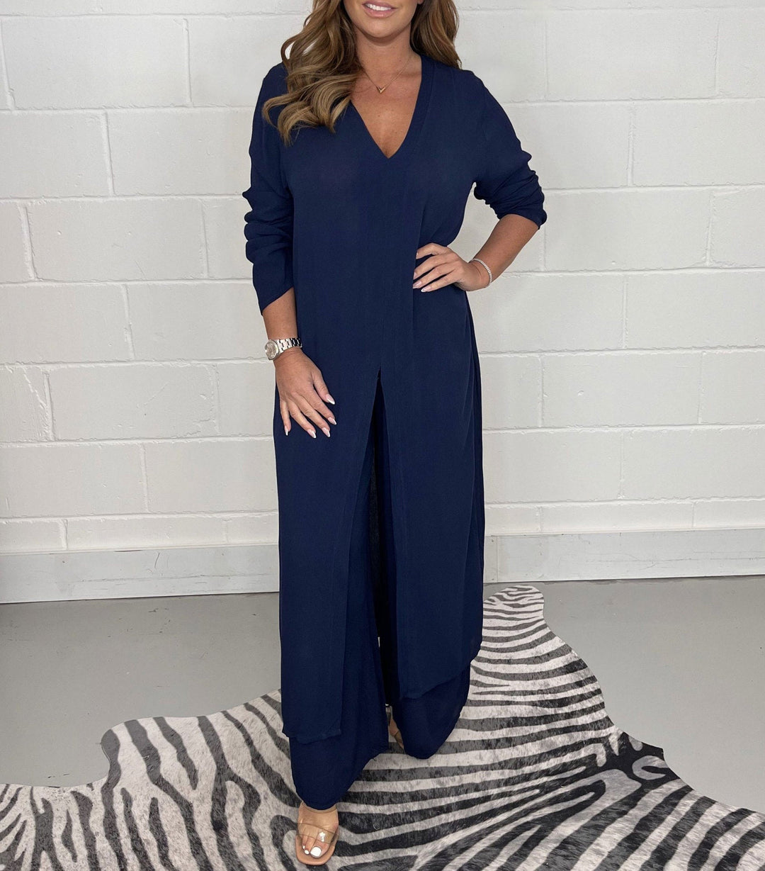 Navy blue two-piece set with V-neck flowy blouse and wide-leg trousers, side slit