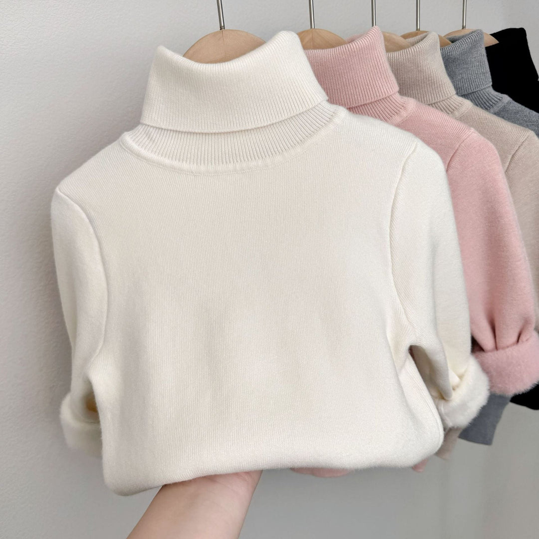 White fleece-lined knit sweater with ribbed turtleneck and long sleeves