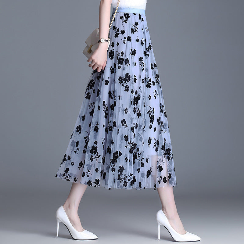 Light blue floral midi skirt with black flower print, elastic waistband, tiered mesh