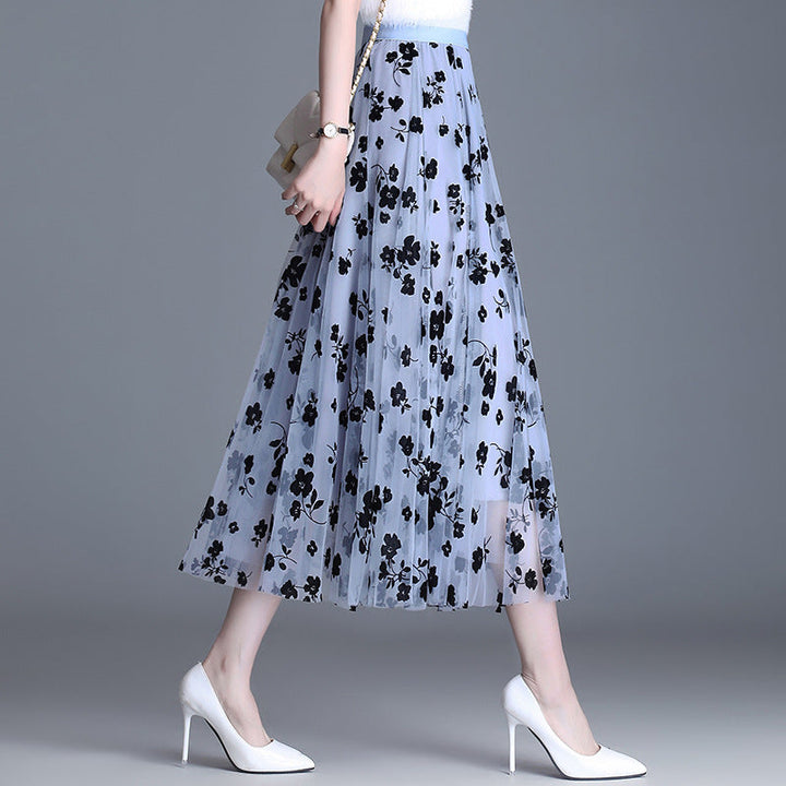 Light blue floral midi skirt with black flower print, elastic waistband, tiered mesh