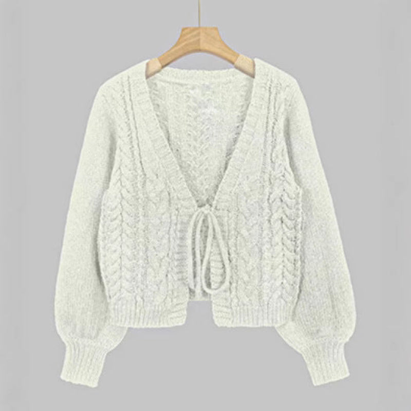White cable-knit tie-front chunky cardigan with V-neck and long sleeves