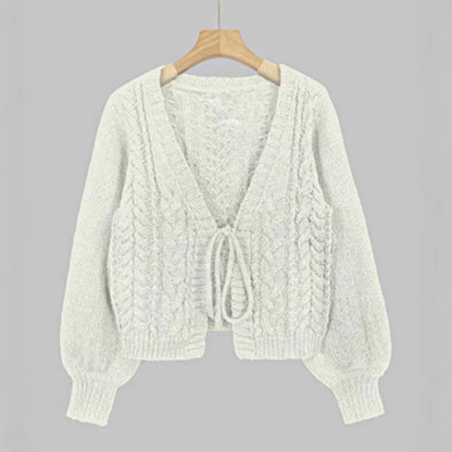 White cable-knit tie-front chunky cardigan with V-neck and long sleeves