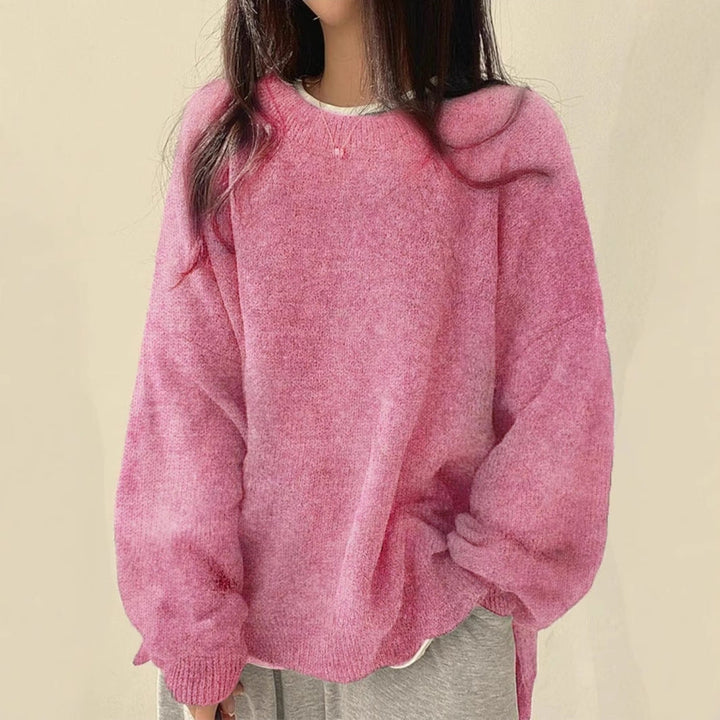 Pink oversized knit sweater with crew neck, long sleeves, ribbed cuffs and hem.