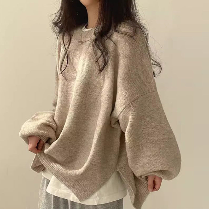 Beige/khaki oversized knit sweater with crew neck, long sleeves, ribbed cuffs and hem.