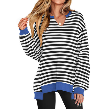 Oversized long-sleeve top in black and white stripes with blue contrast cuffs and hem
