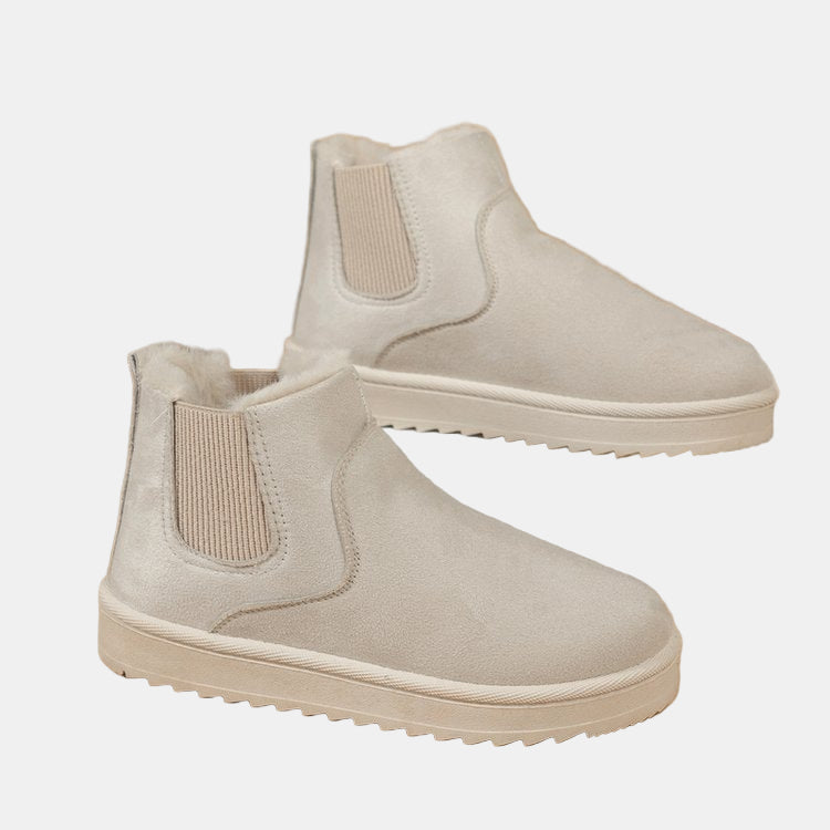 Off-white cozy ankle boots with faux fur trim, elastic side gusset, grippy sole