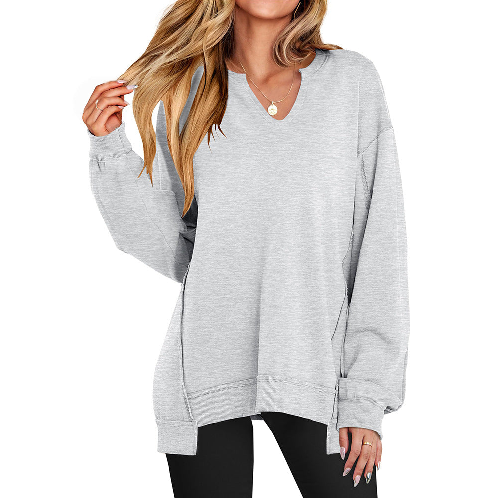 Oversized long-sleeve top in heather gray with V-neck and gathered cuff detail