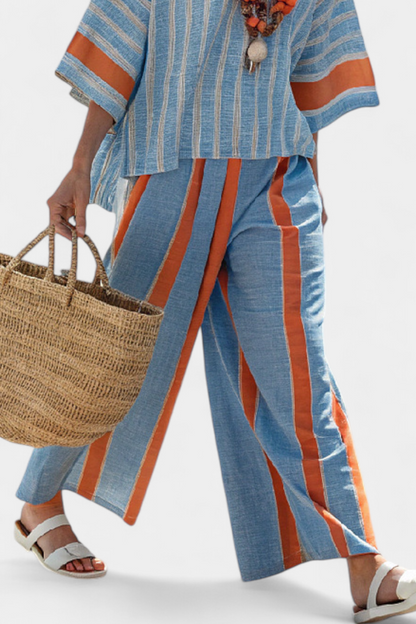 Blue striped linen trousers with orange panels and matching striped top